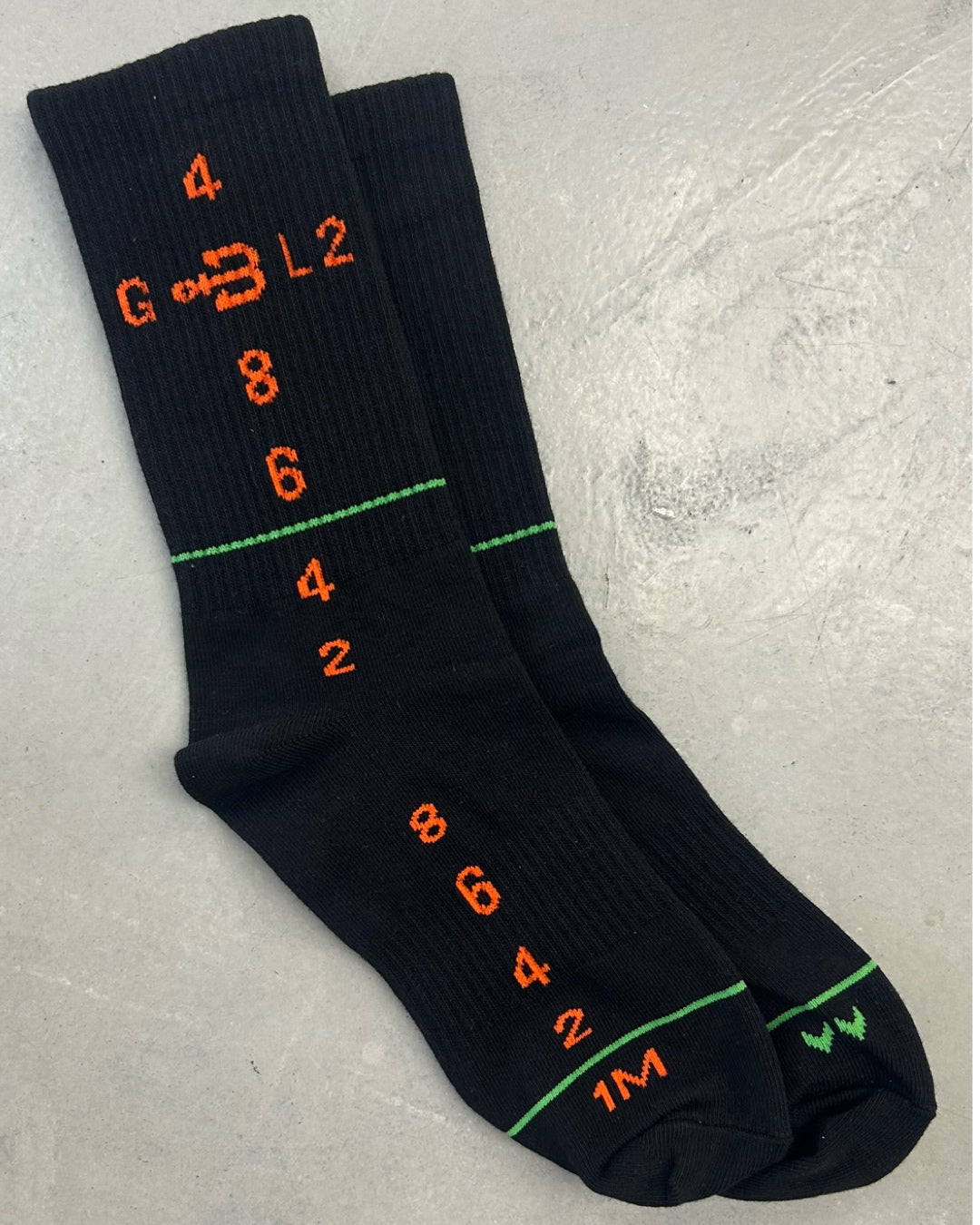 Black sport socks BAHNS by helicopter with orange graphics