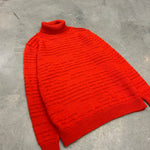 Orange turtleneck wool sweater in oversized fit