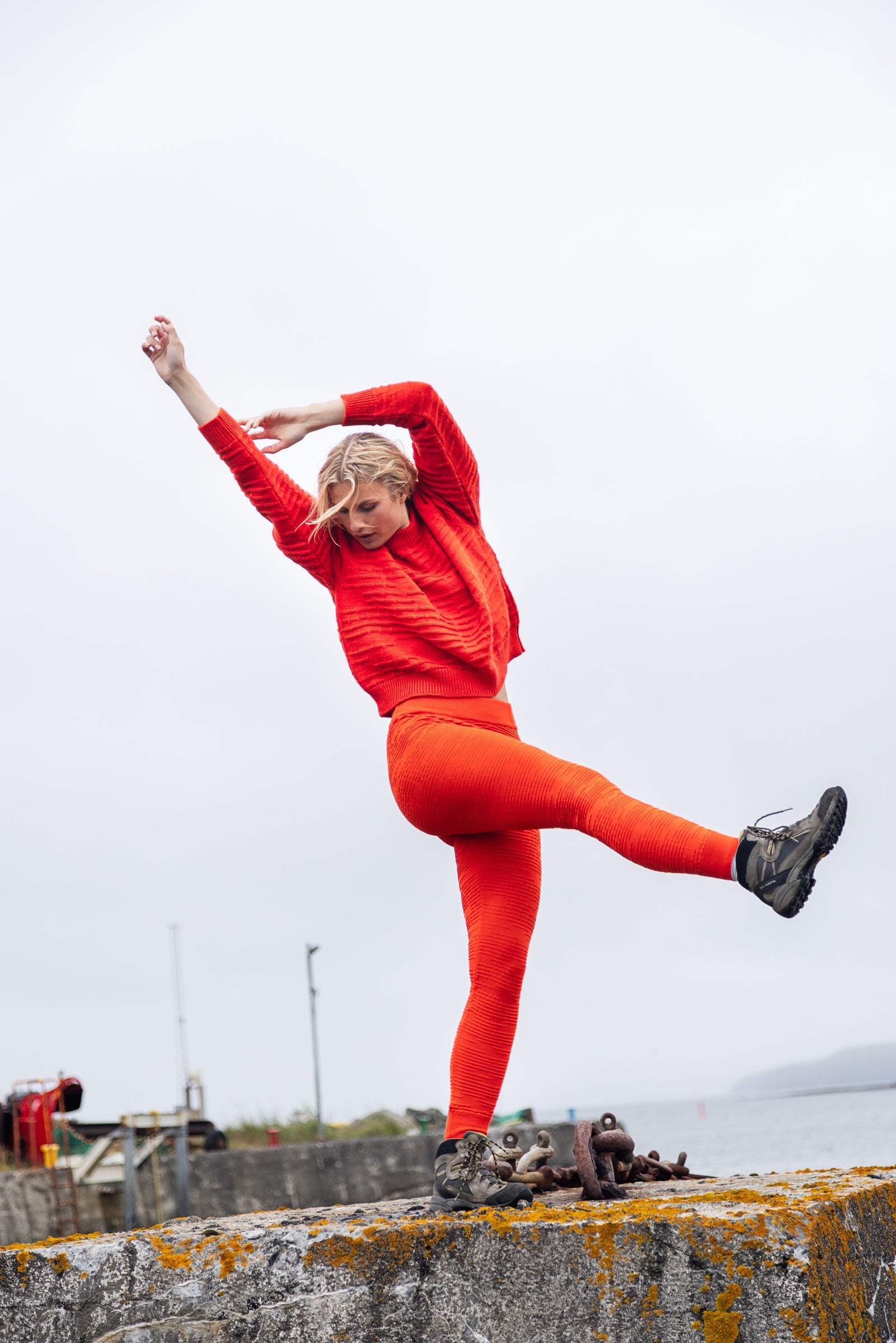 Cropped James Cook wool sweater from BAHNS in blood orange color