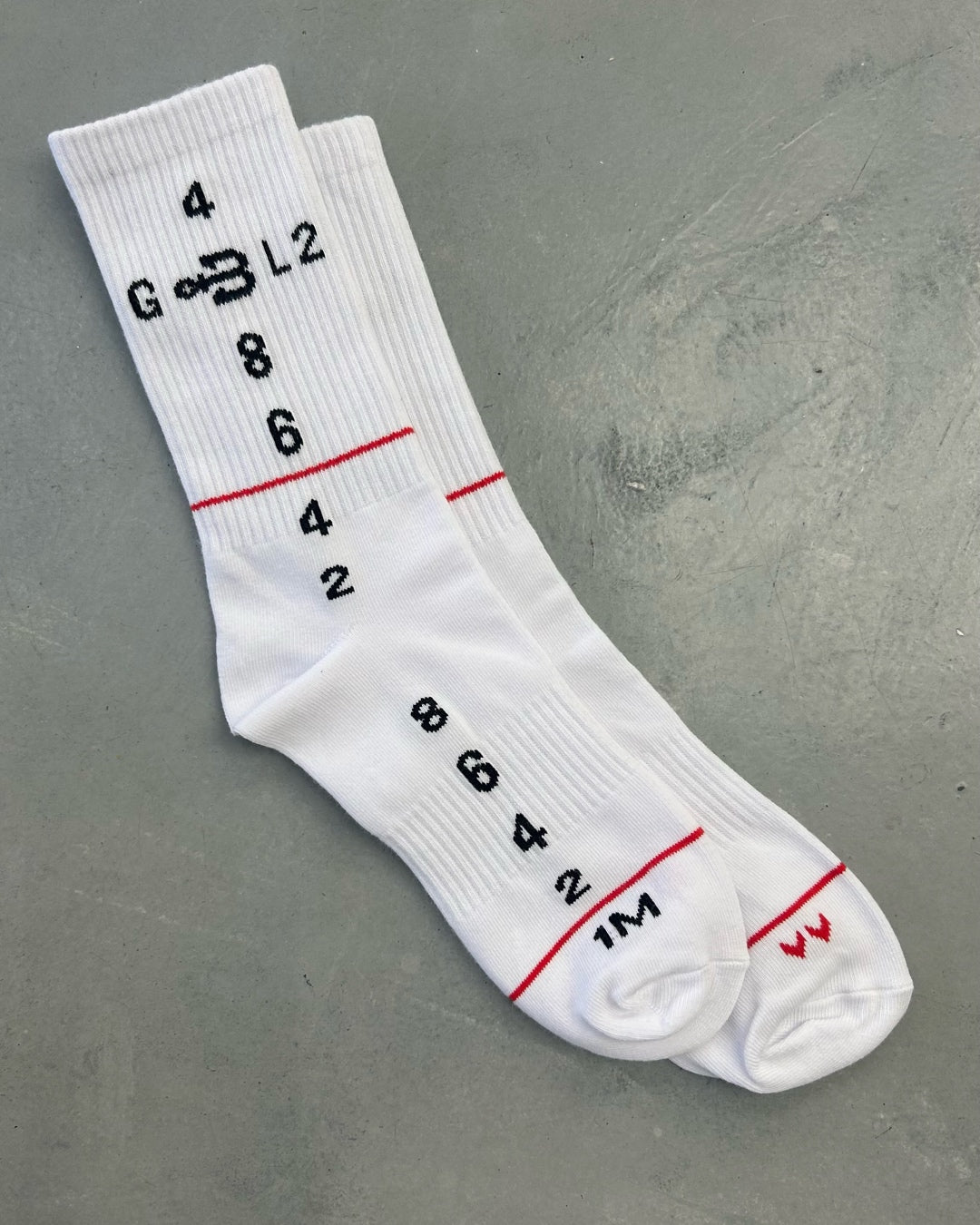 A pair of white sport socks from BAHNS by helicopter
