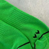 Bright green athletic socks with black graphics
